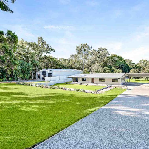 a house with a lawn and trees